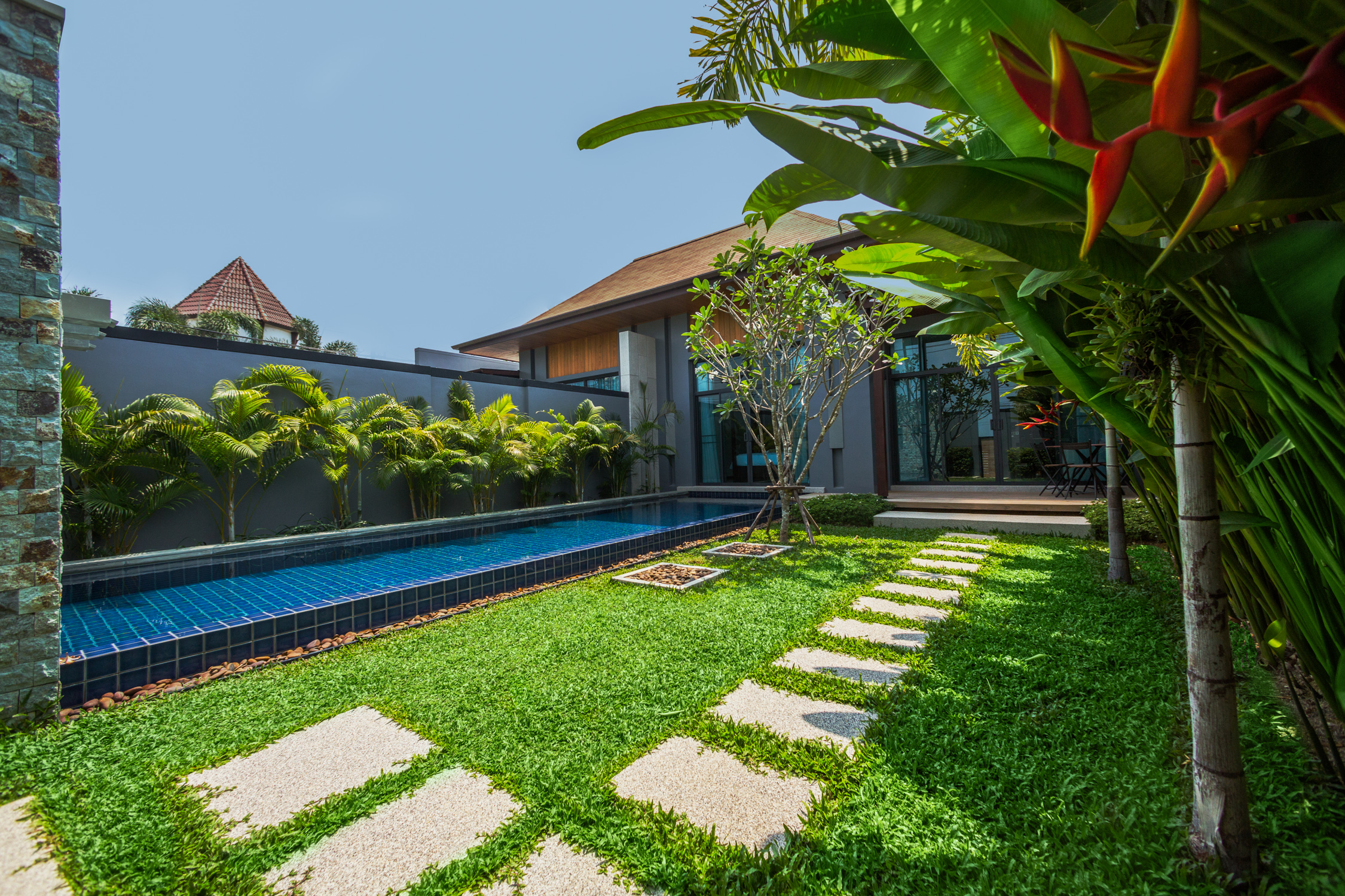 2 bedroom villa with a terrace and a pool in Nai Harn