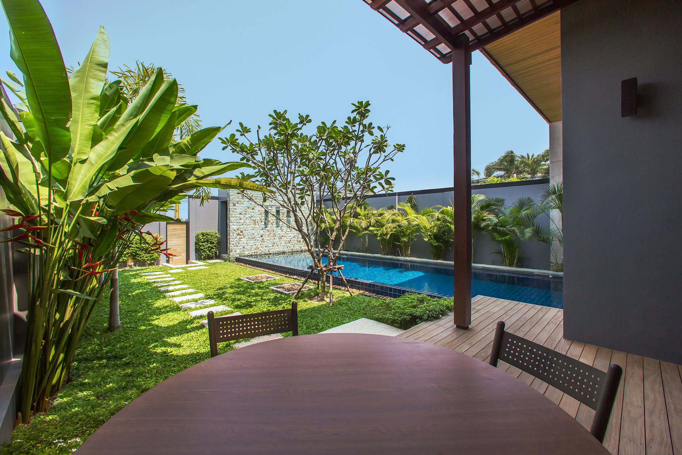 2 bedroom villa with a terrace and a pool in Nai Harn